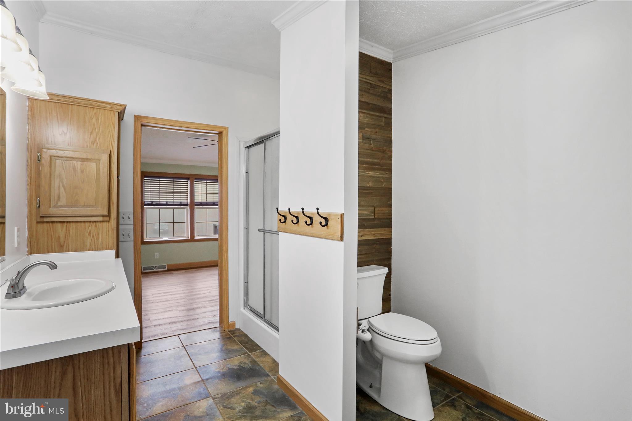 3688 Ash Ruckman Road Augusta, WV 26704 - Photo 22 of 66 a bathroom with a sink a toilet and shower