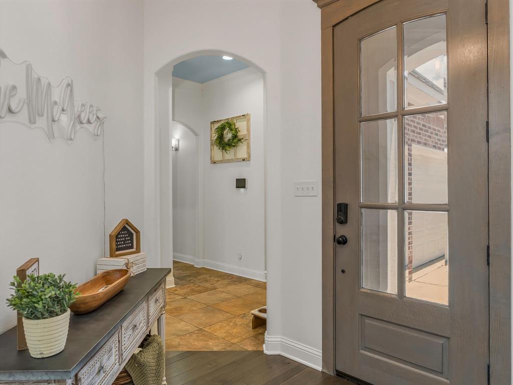 690 Lessie Drive Stonewall, LA 71078 - Photo 4 of 29 Entryway featuring a paneled door with glass inserts, dark wood-finish flooring, and crisp white baseboards