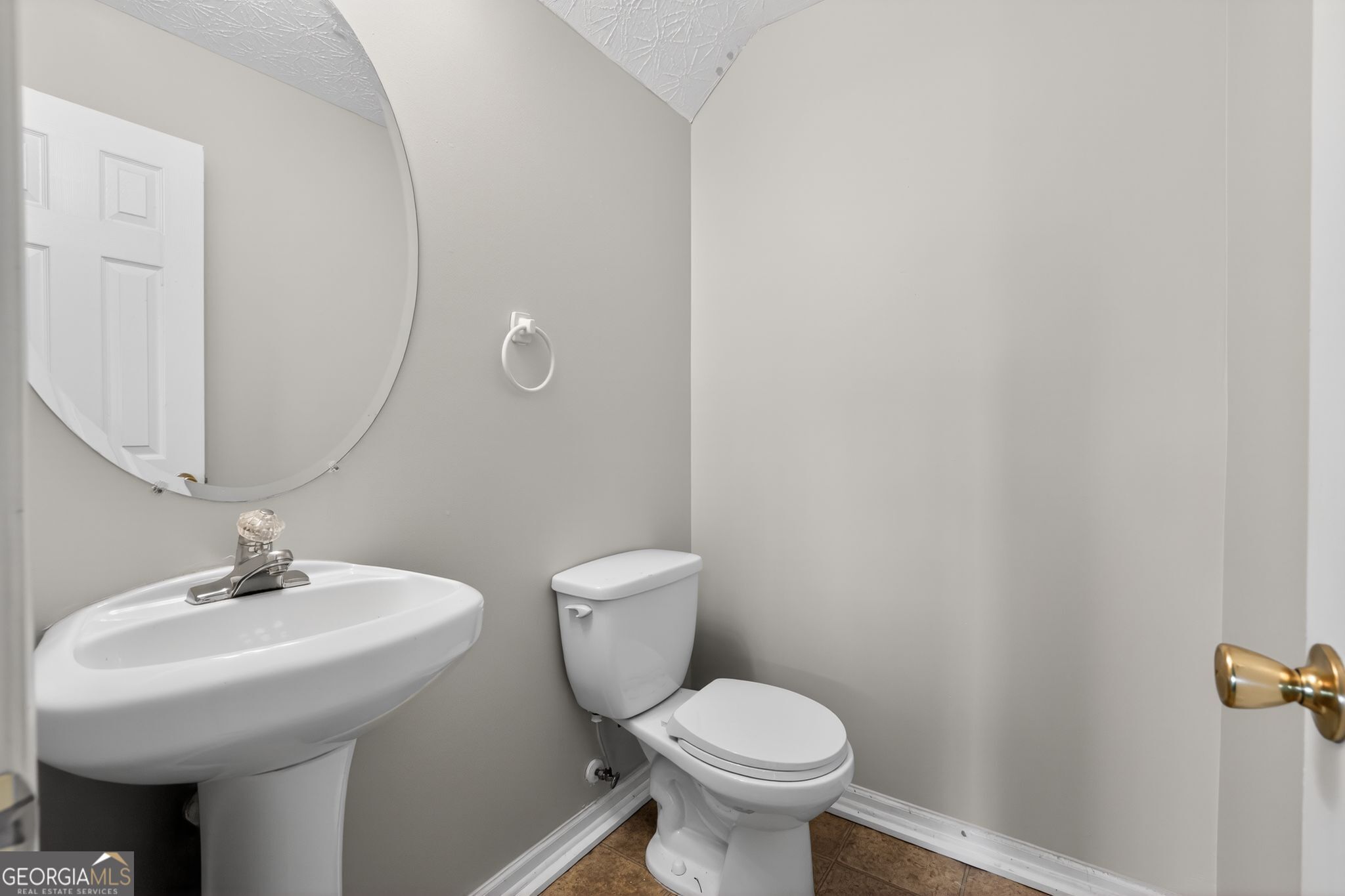6256 Lake Valley Point Lithonia, GA 30058 - Photo 22 of 33 a bathroom with a sink toilet and a mirror