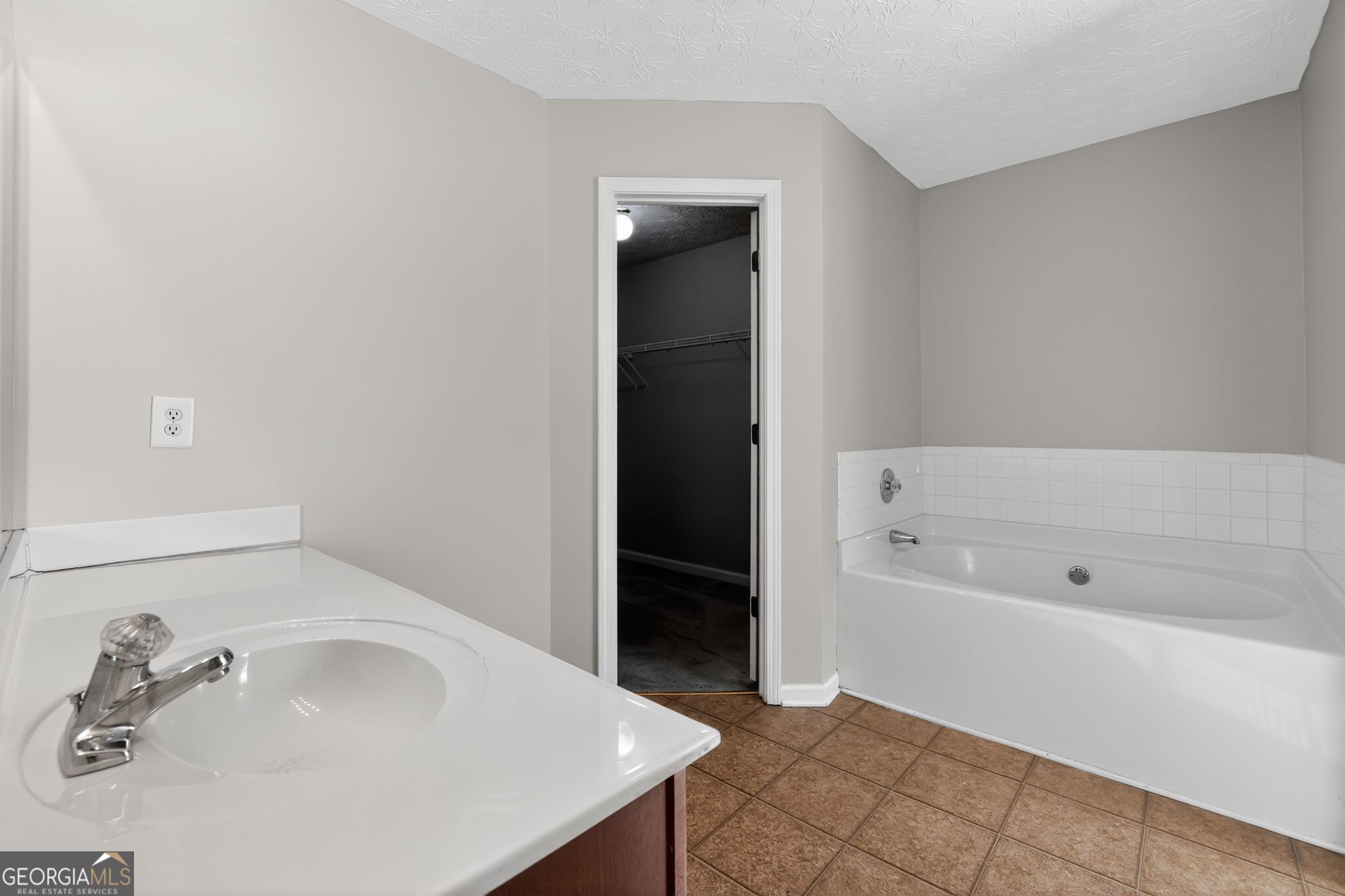 6256 Lake Valley Point Lithonia, GA 30058 - Photo 24 of 33 a bathroom with a bathtub and a sink