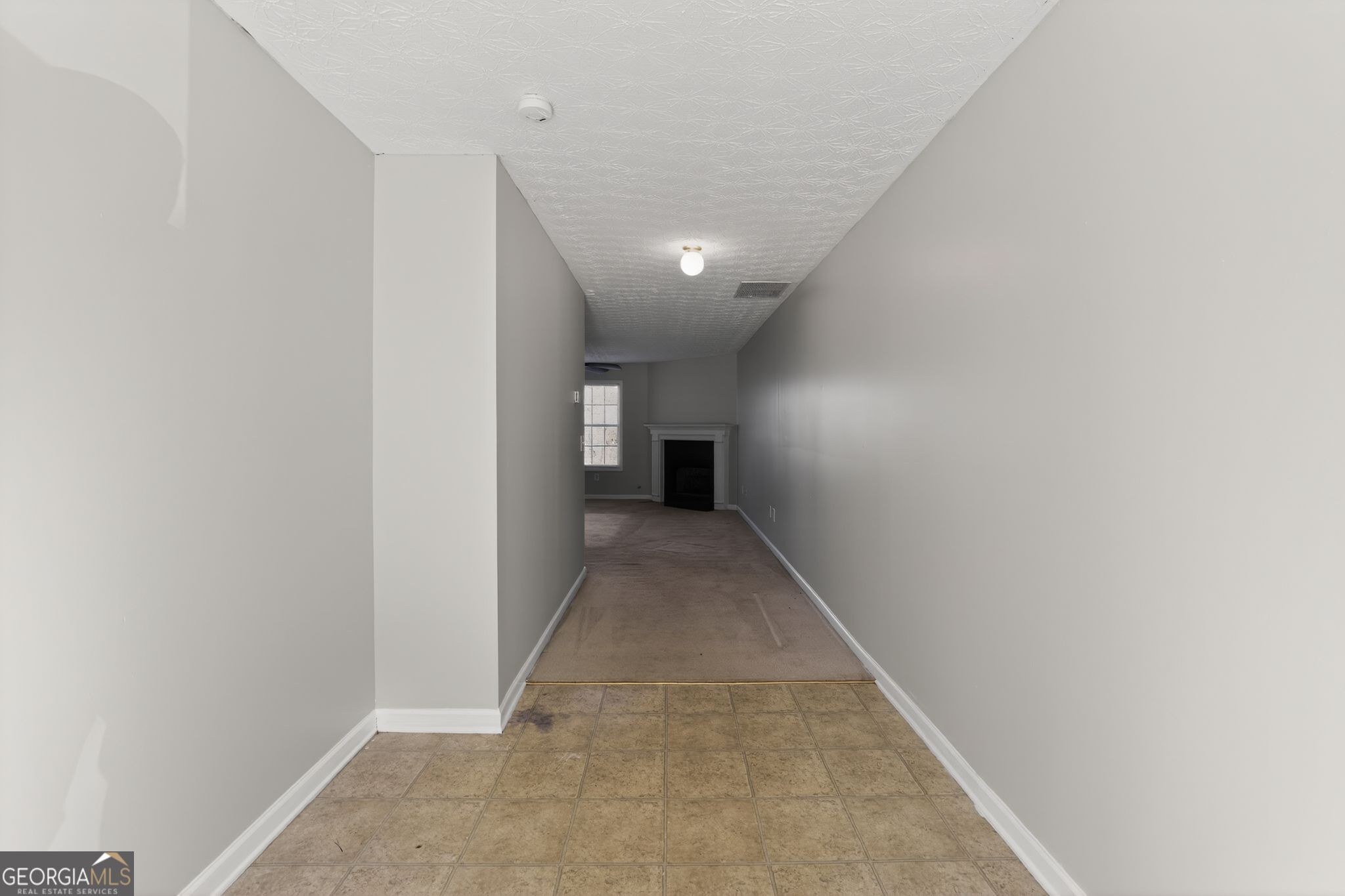 6256 Lake Valley Point Lithonia, GA 30058 - Photo 4 of 33 a view of a hallway with wooden floor and a window