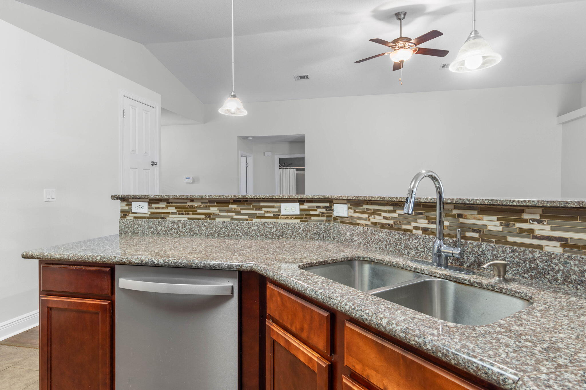 5609 Price Plantation Road Baker, FL 32531 - Photo 14 of 49 a kitchen with a sink granite counter tops and a window