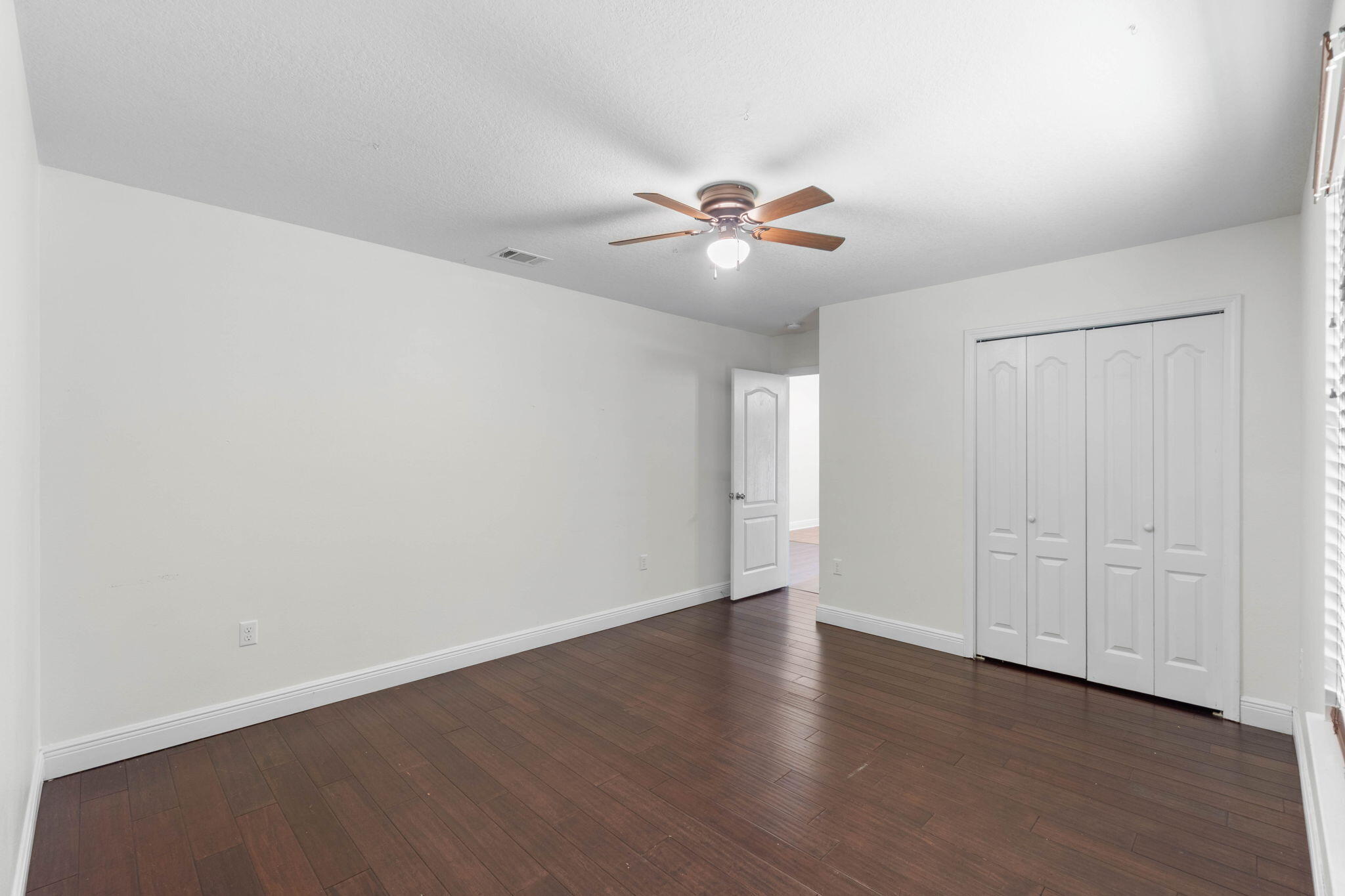 5609 Price Plantation Road Baker, FL 32531 - Photo 19 of 49 a view of an empty room with a fan