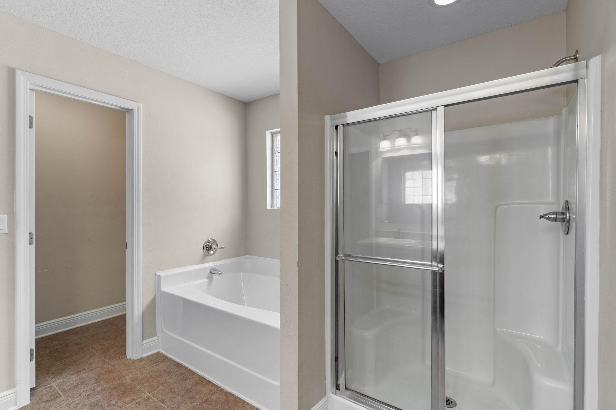 5609 Price Plantation Road Baker, FL 32531 - Photo 27 of 49 a bathroom with a bathtub and a shower