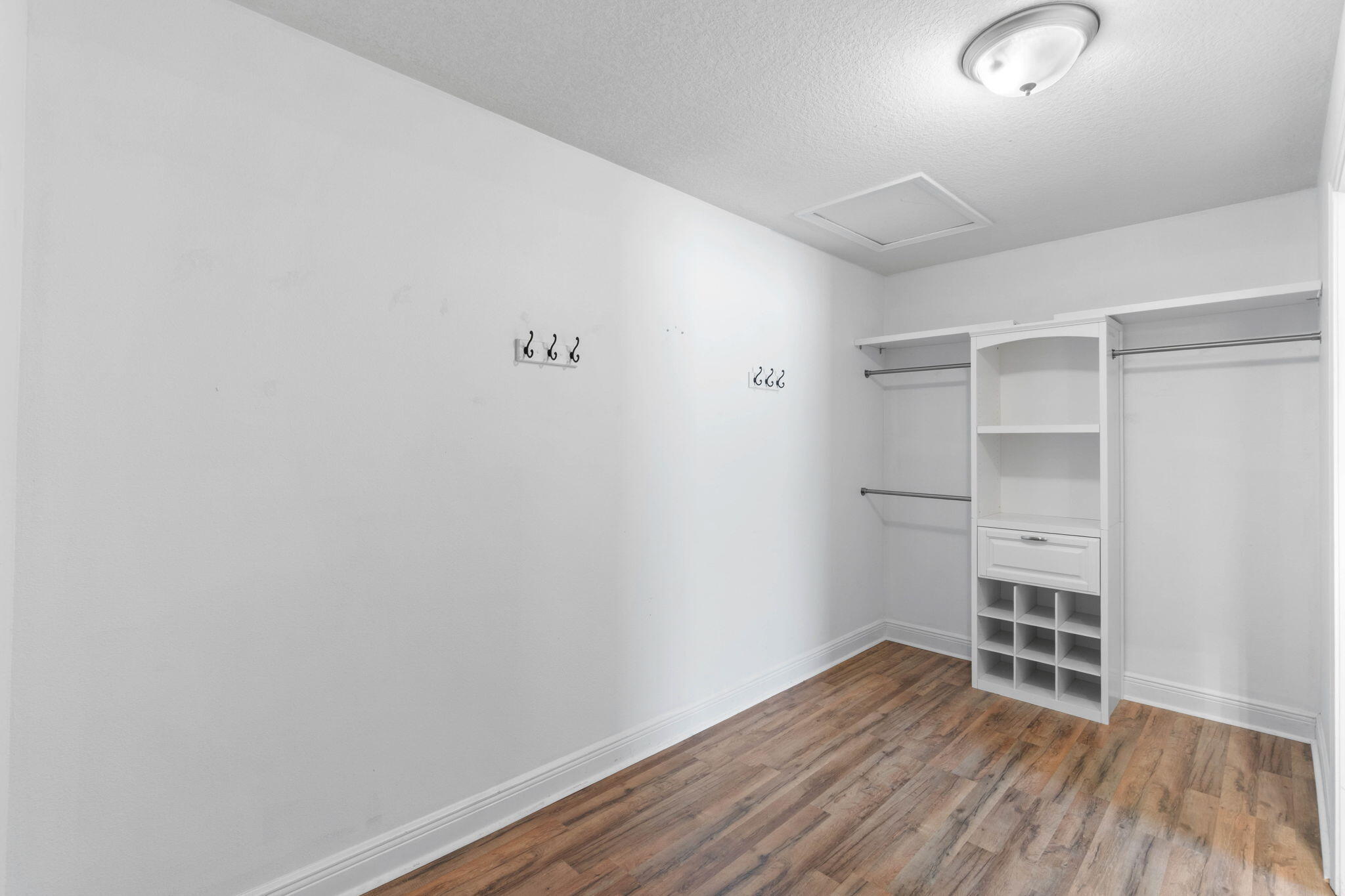 5609 Price Plantation Road Baker, FL 32531 - Photo 29 of 49 a view of an empty room with wooden floor and closet