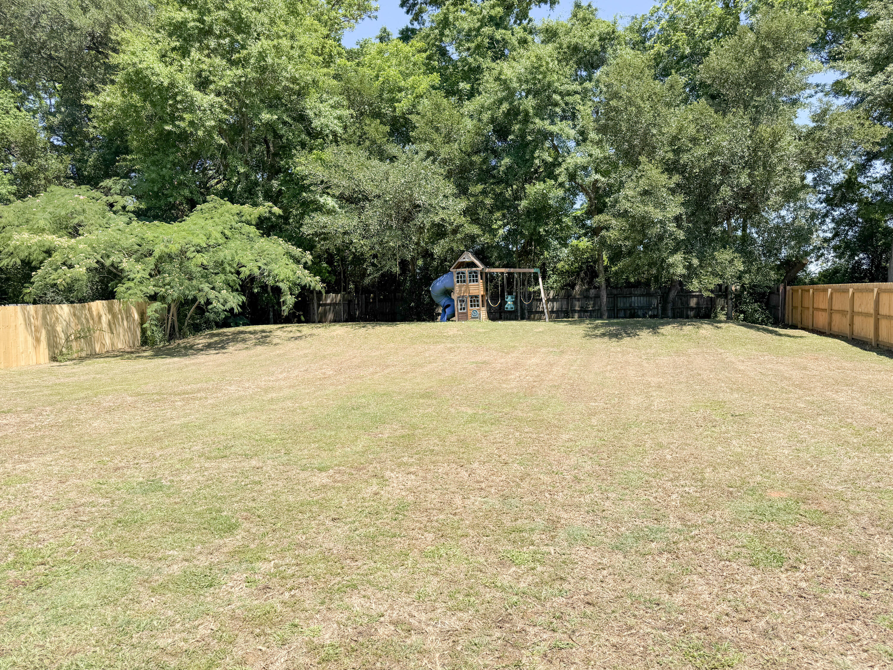 5609 Price Plantation Road Baker, FL 32531 - Photo 30 of 49 a view of an outdoor space and a yard