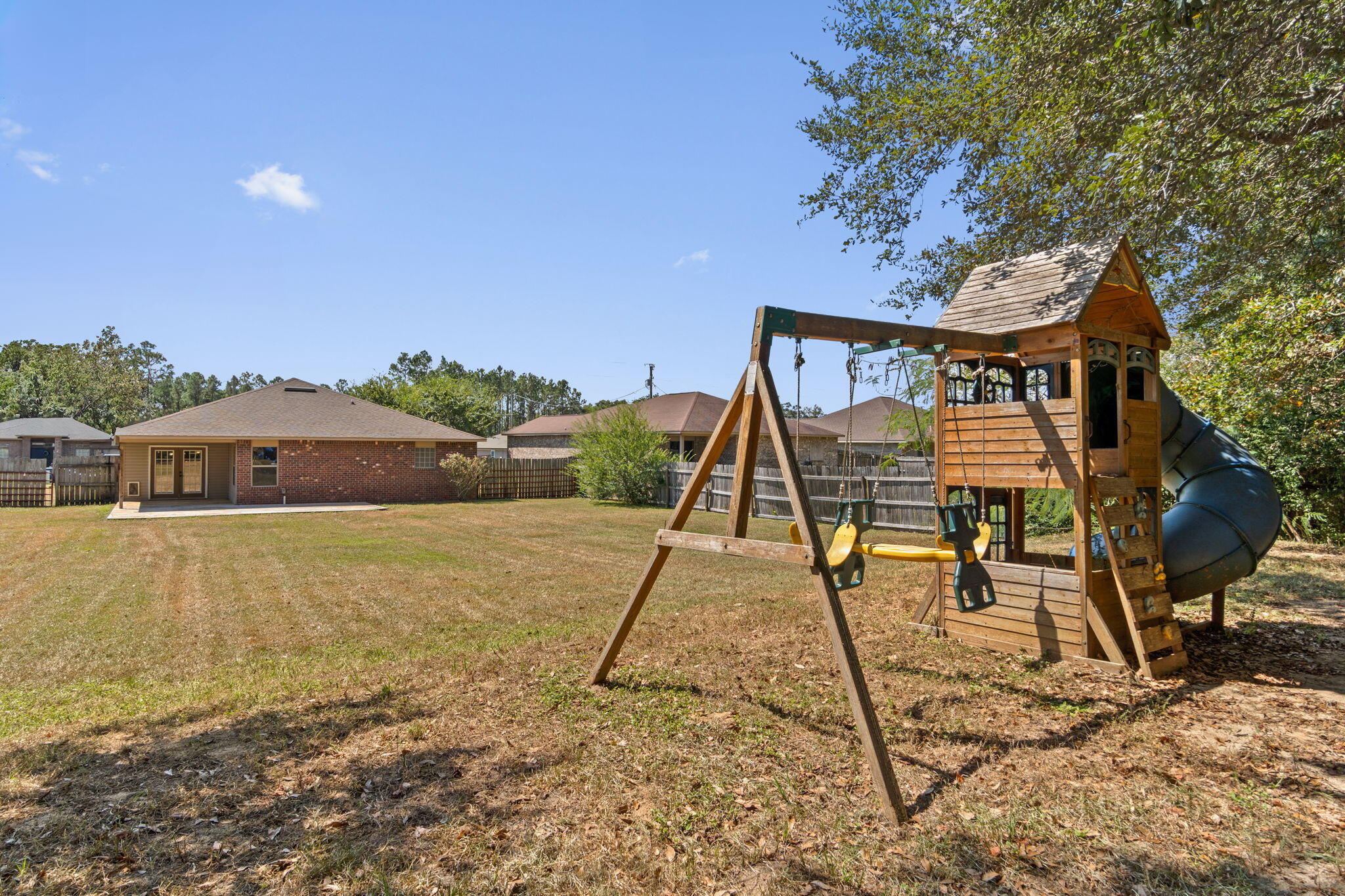 5609 Price Plantation Road Baker, FL 32531 - Photo 36 of 49 a front view of a house with a yard