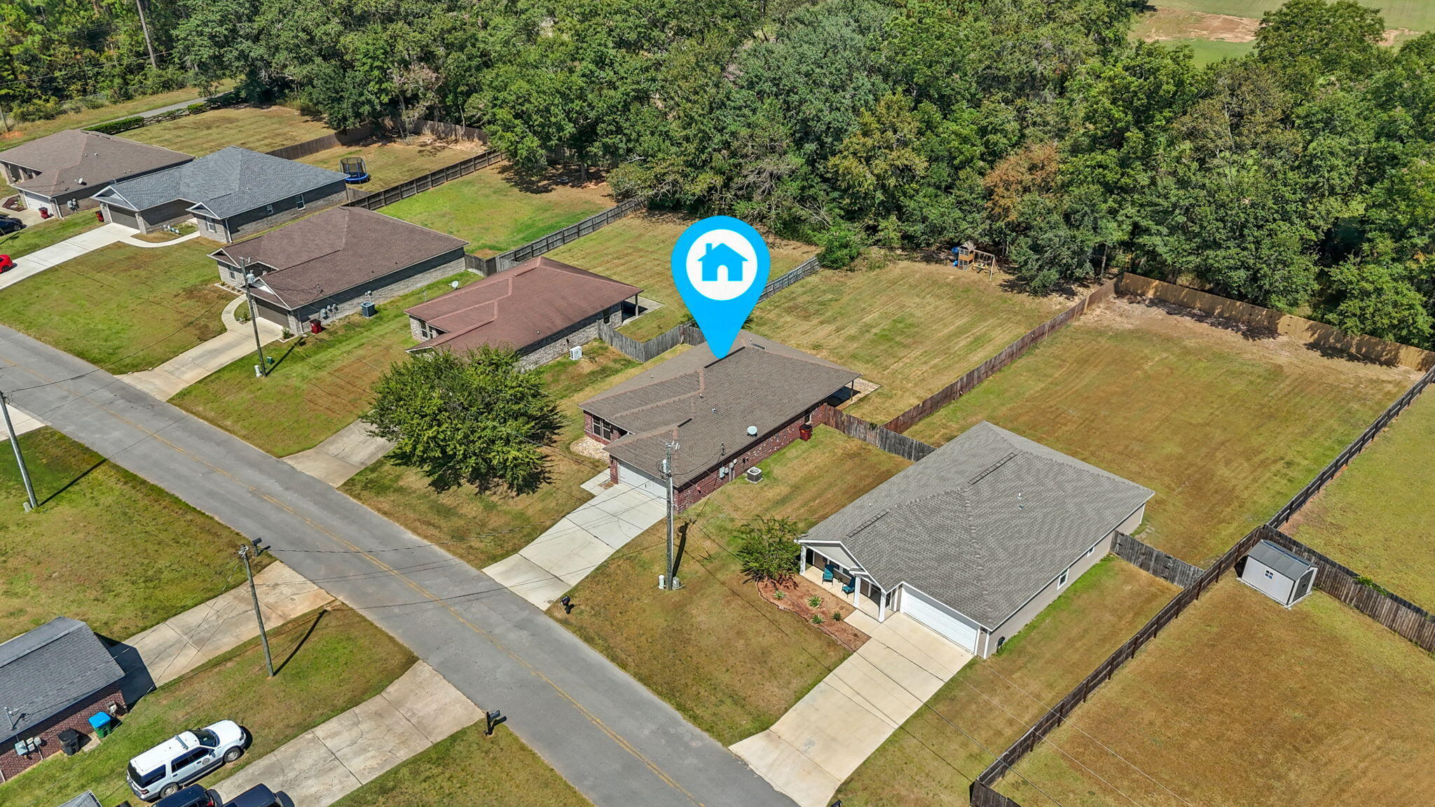 5609 Price Plantation Road Baker, FL 32531 - Photo 39 of 49 an aerial view of a house with a swimming pool