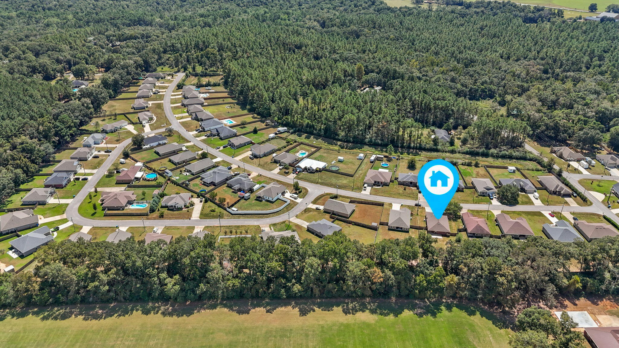 5609 Price Plantation Road Baker, FL 32531 - Photo 42 of 49 an aerial view of a house with a swimming pool outdoor seating and yard