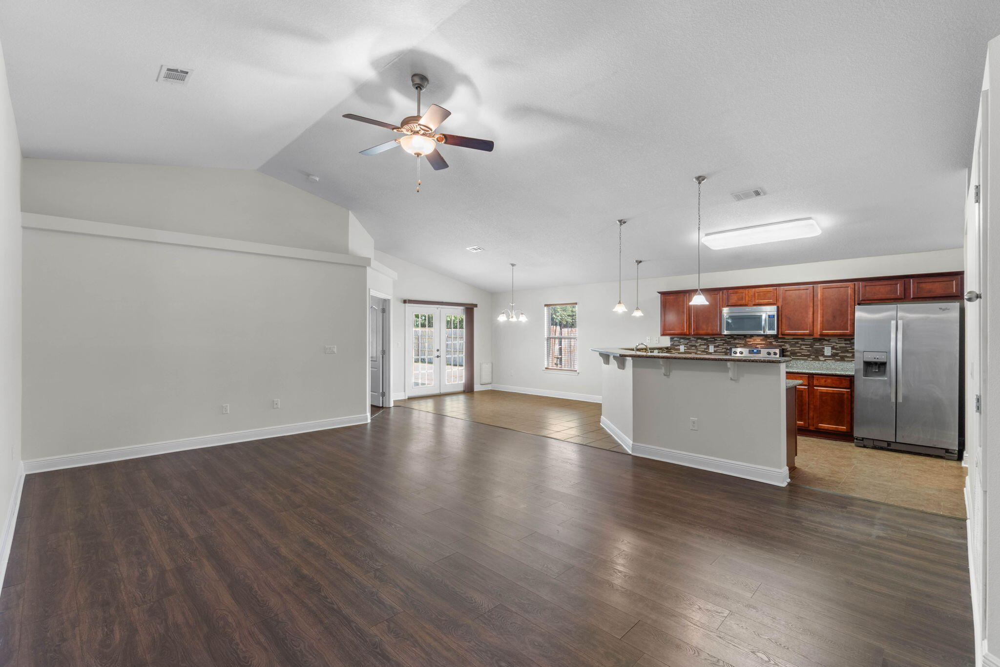 5609 Price Plantation Road Baker, FL 32531 - Photo 5 of 49 a view of a kitchen with a sink wooden floor and a kitchen