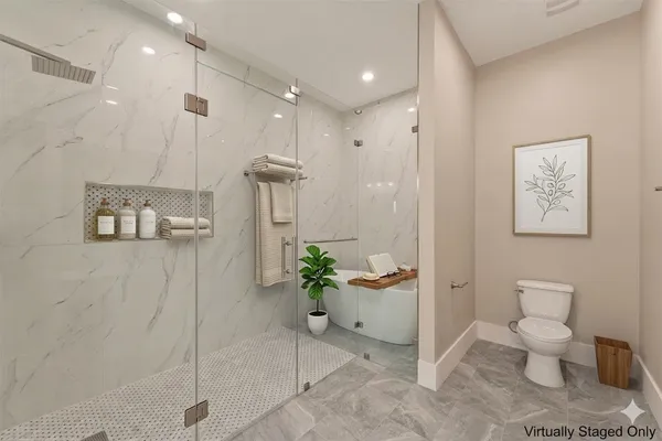 a bathroom with a toilet sink and shower