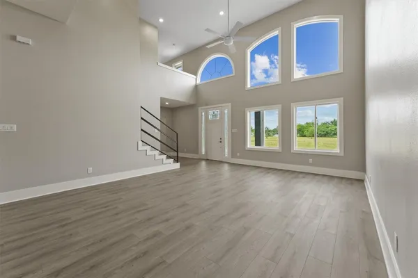 a view of an entryway with wooden floor