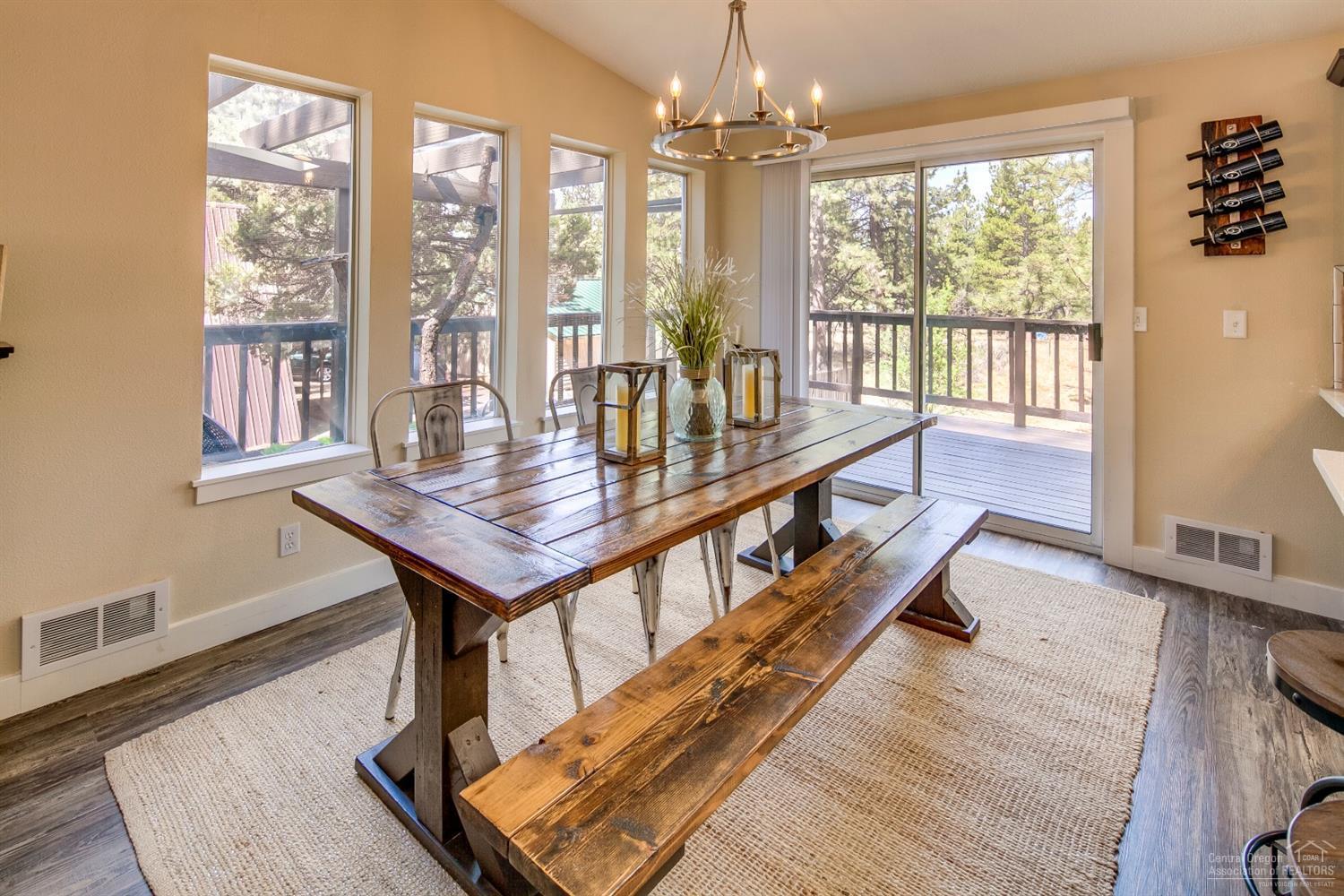 60175 Cheyenne Road Bend, OR 97702 - Photo 6 of 24 a view of a livingroom with furniture window and wooden floor