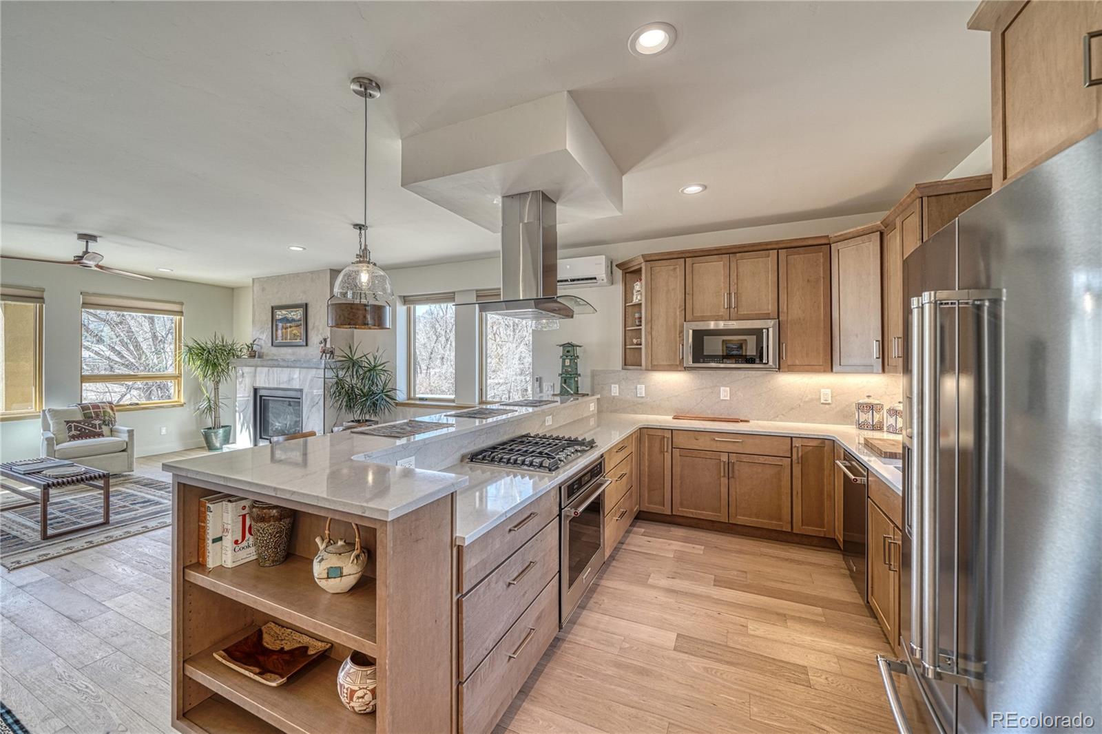 205 Two Rivers Road, Unit G Salida, CO 81201 - Photo 3 of 13 a kitchen with stainless steel appliances granite countertop a sink stove and refrigerator