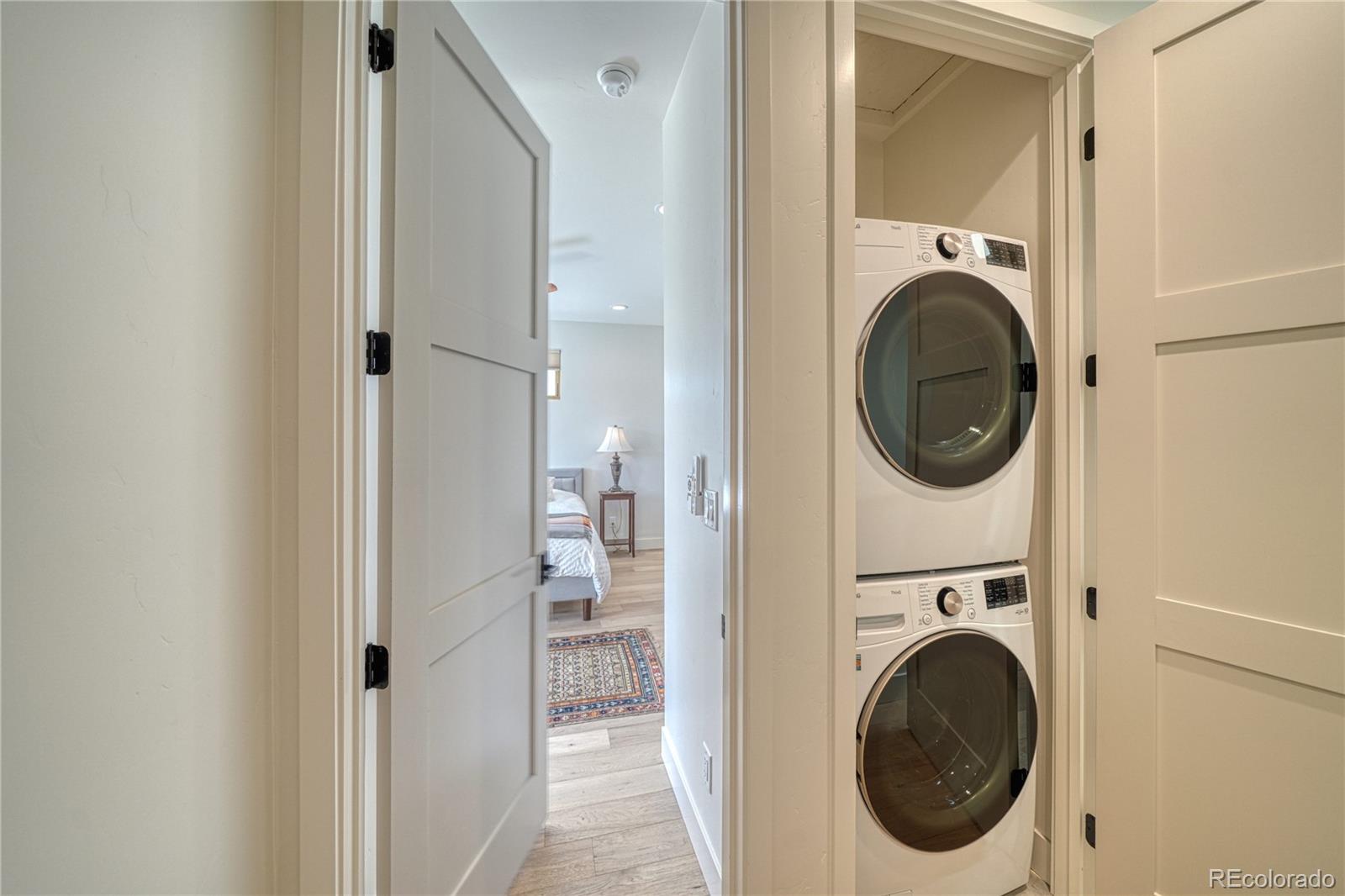 205 Two Rivers Road, Unit G Salida, CO 81201 - Photo 8 of 13 a view of a hallway with washer and dryer