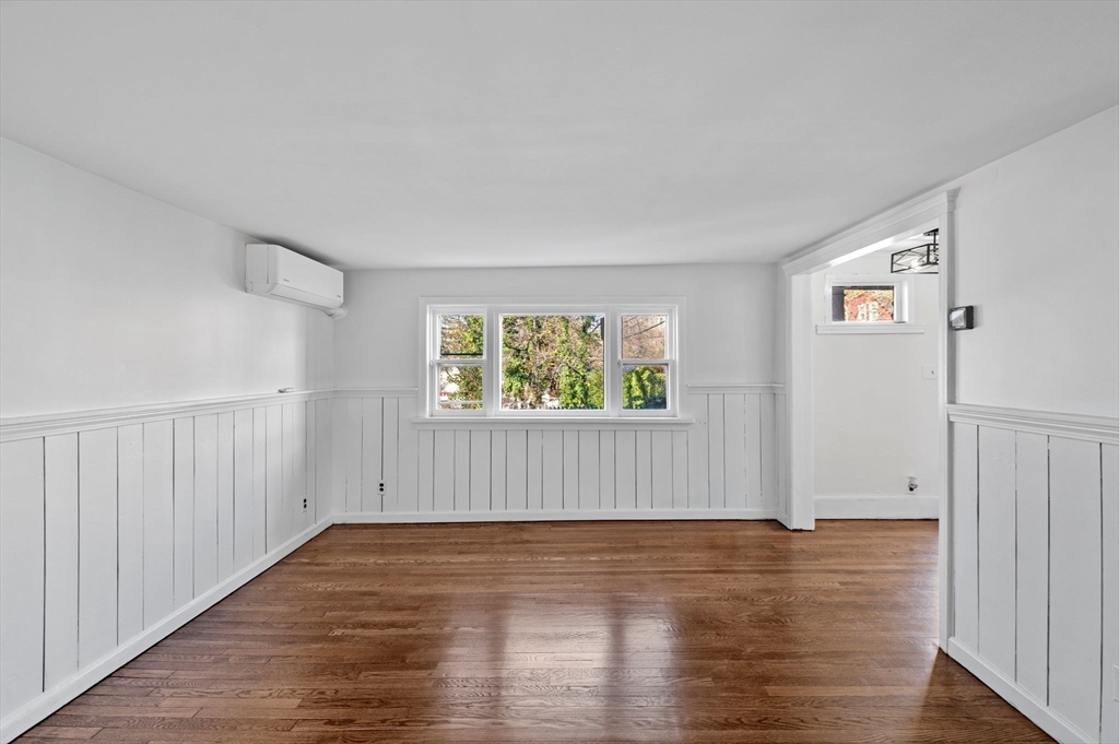 268 Walnut Street Lynn, MA 01905 - Photo 11 of 42 an empty room with wooden floor and windows