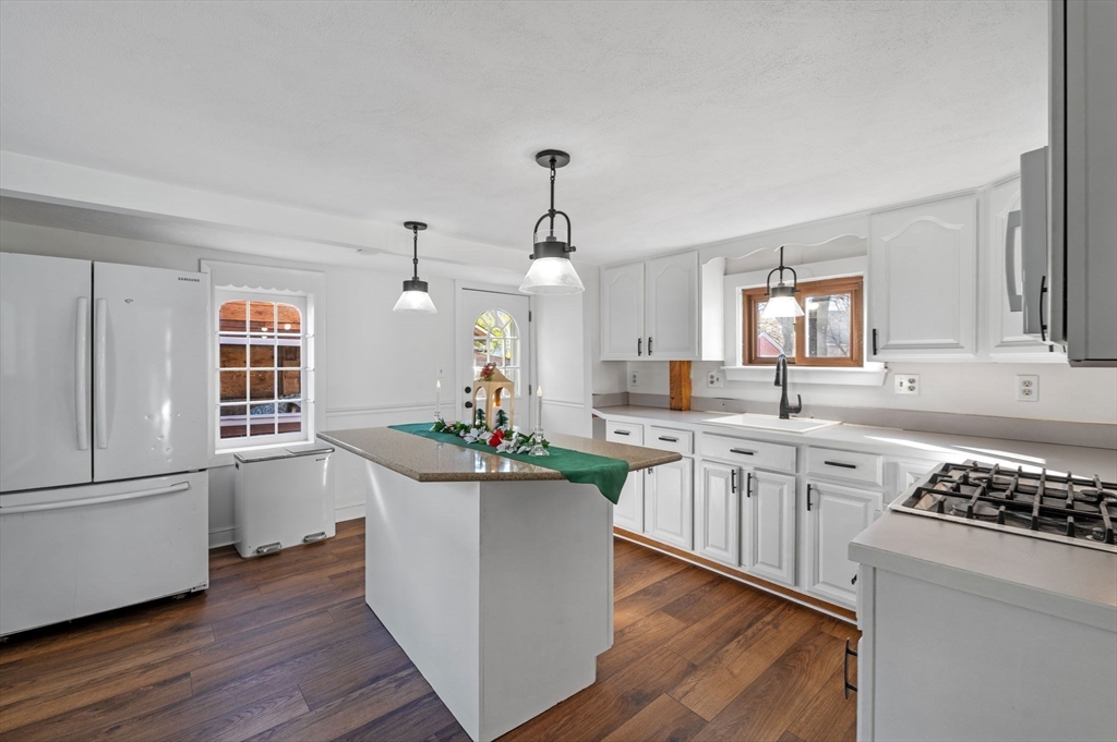 268 Walnut Street Lynn, MA 01905 - Photo 14 of 41 a kitchen with sink refrigerator and stove