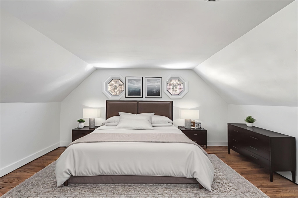 268 Walnut Street Lynn, MA 01905 - Photo 20 of 41 a bedroom with a bed and a lamp with table