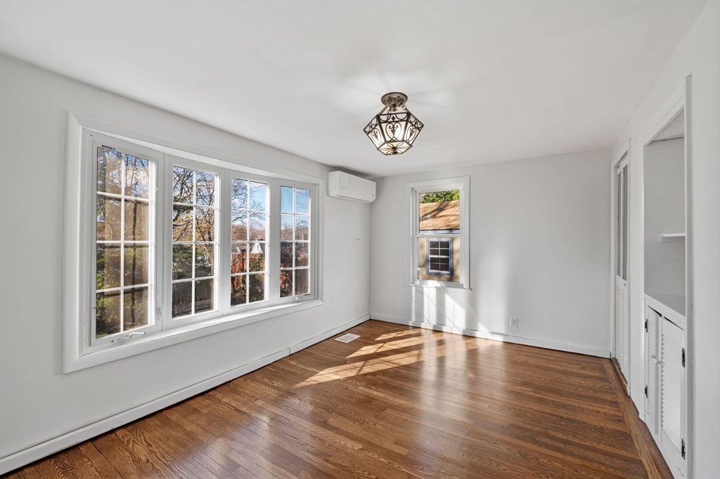 268 Walnut Street Lynn, MA 01905 - Photo 20 of 42 a view of an empty room with wooden floor and a window
