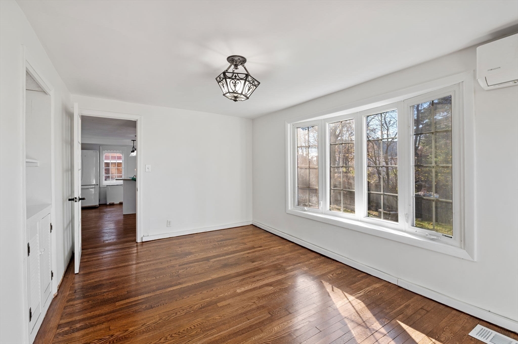 268 Walnut Street Lynn, MA 01905 - Photo 23 of 42 a view of an empty room with wooden floor and a window