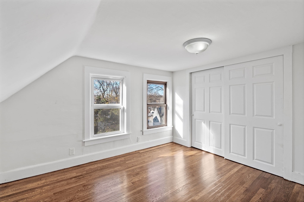 268 Walnut Street Lynn, MA 01905 - Photo 29 of 42 a view of an empty room with wooden floor and a window