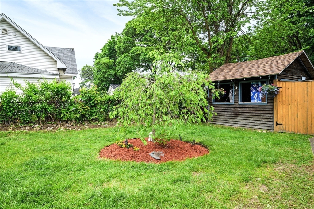 268 Walnut Street Lynn, MA 01905 - Photo 30 of 41 a view of a backyard with a garden