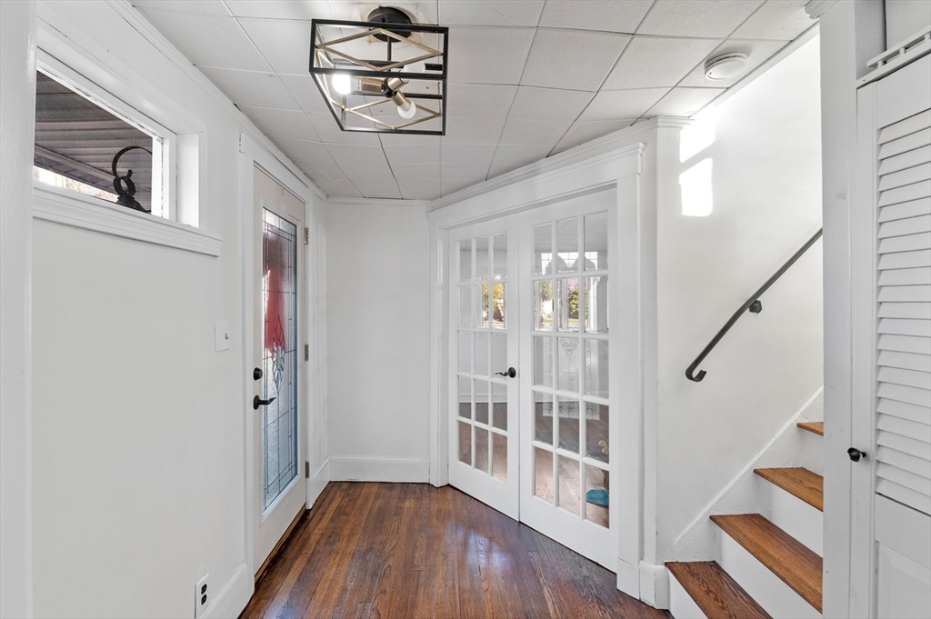 268 Walnut Street Lynn, MA 01905 - Photo 5 of 42 a view of a hallway with wooden floor and staircase