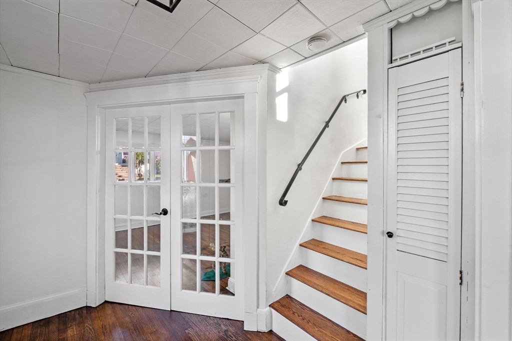 268 Walnut Street Lynn, MA 01905 - Photo 6 of 42 a view of staircase with wooden floor and white walls