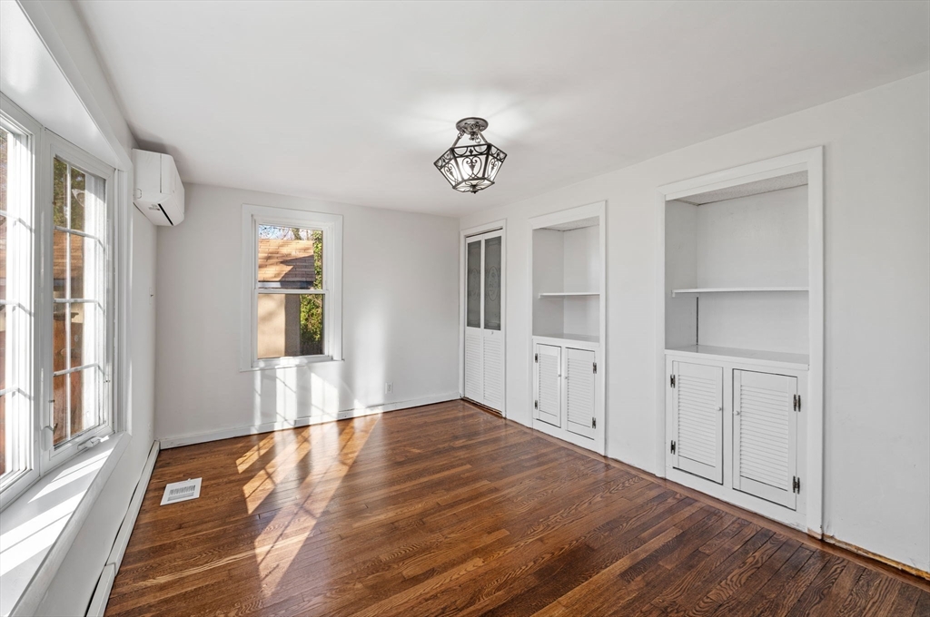 268 Walnut Street Lynn, MA 01905 - Photo 10 of 41 a view of an empty room with wooden floor and a window