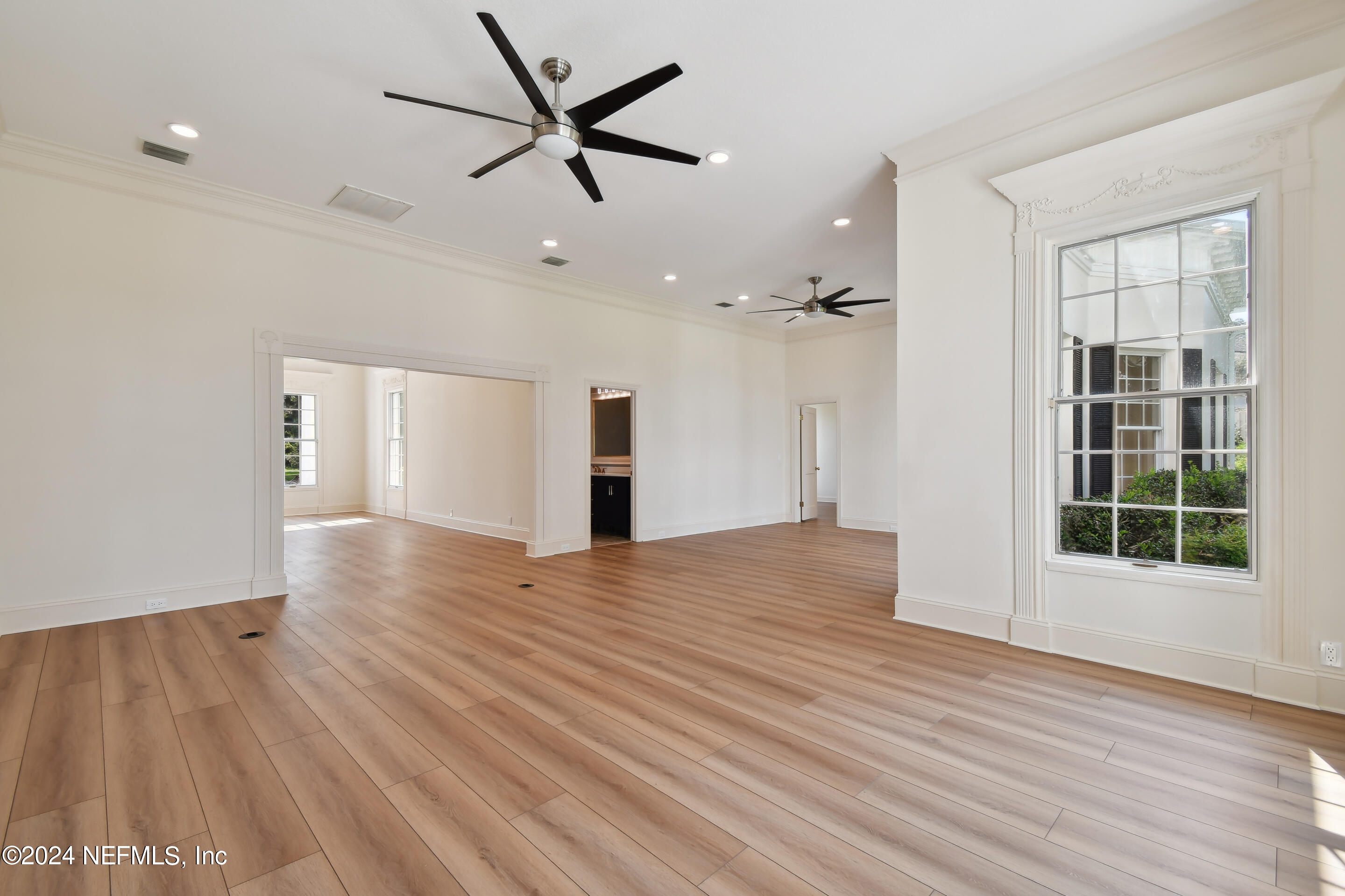 13936 Mandarin Road Jacksonville, FL 32223 - Photo 27 of 86 a view of empty room with wooden floor and window