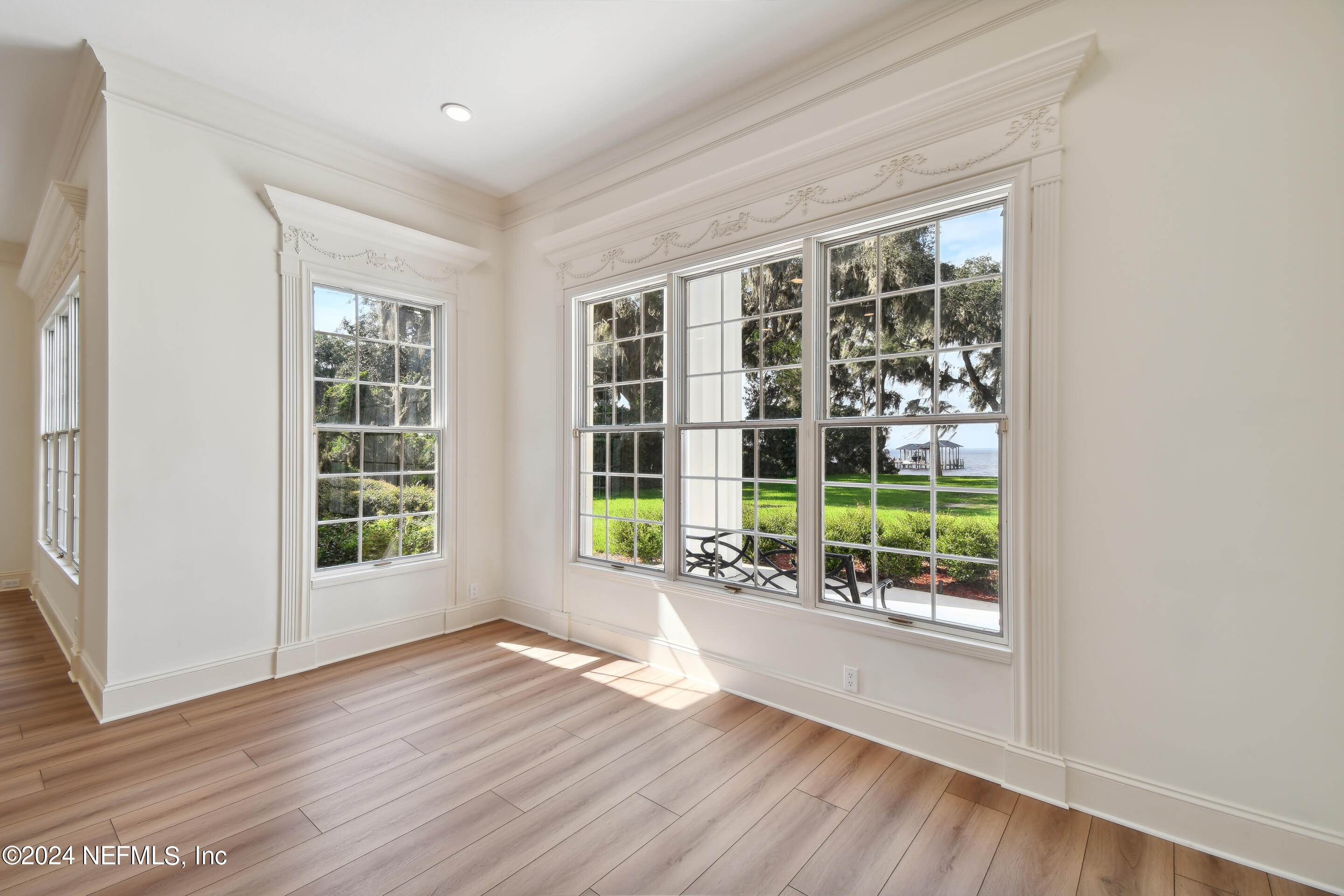 13936 Mandarin Road Jacksonville, FL 32223 - Photo 28 of 86 an empty room with wooden floor and garden