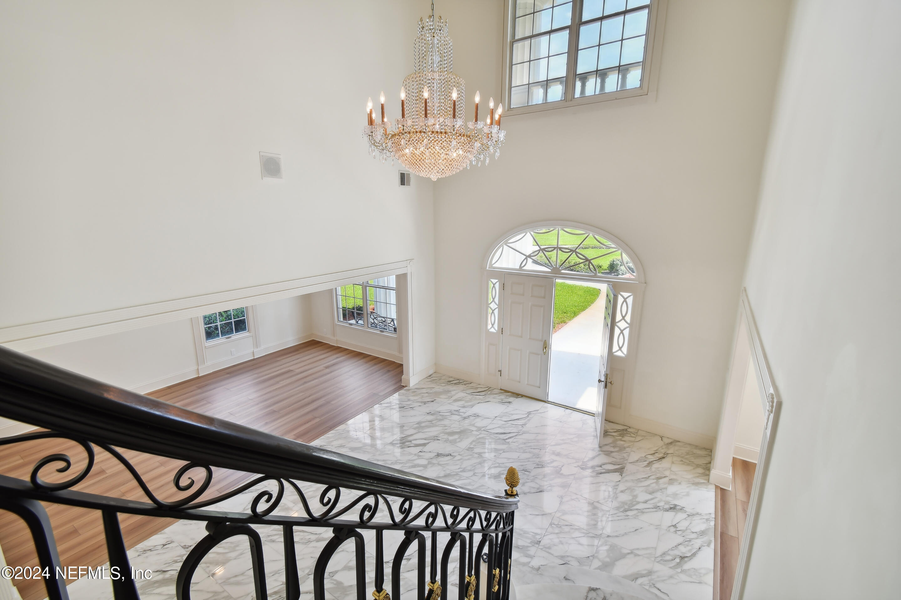 13936 Mandarin Road Jacksonville, FL 32223 - Photo 35 of 86 a view of a dining room with furniture and a chandelier
