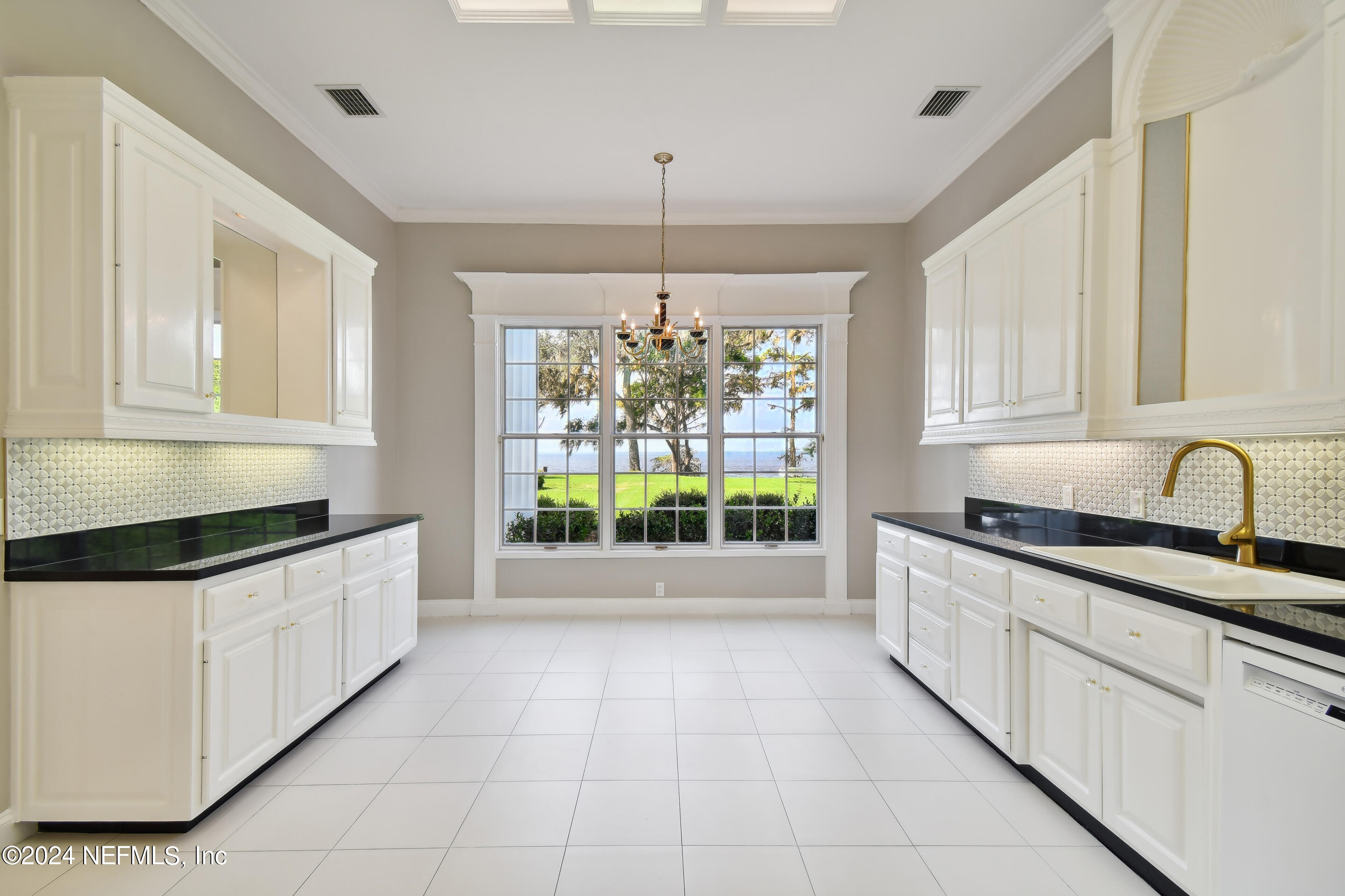 13936 Mandarin Road Jacksonville, FL 32223 - Photo 53 of 86 a kitchen with granite countertop a stove and a sink