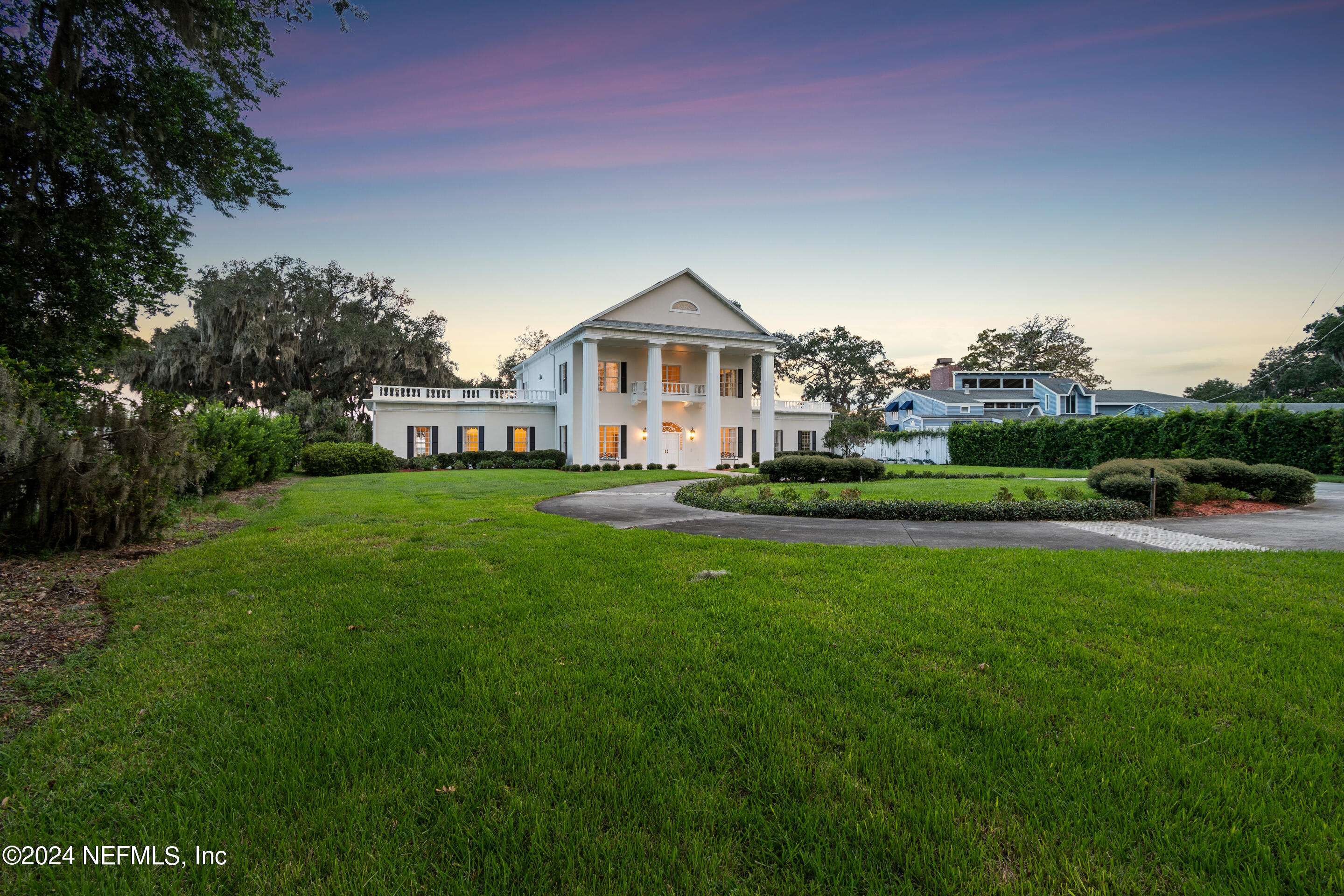 13936 Mandarin Road Jacksonville, FL 32223 - Photo 62 of 86 a front view of a house with a yard table and chairs