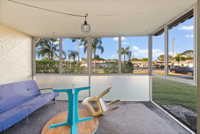 an aerial view of residential houses with outdoor space and lake view