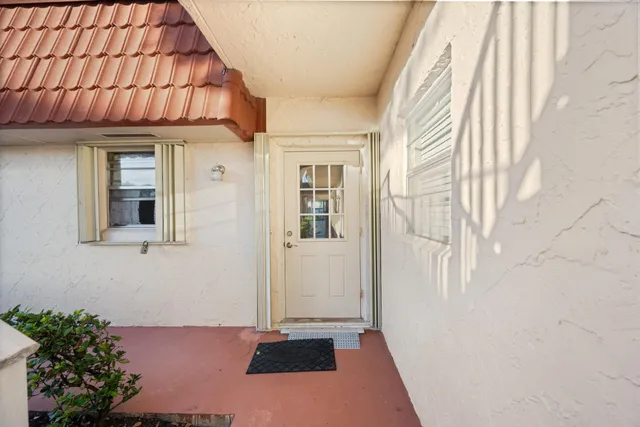 a view of a swimming pool and outdoor seating