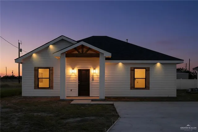 a front view of a house with yard