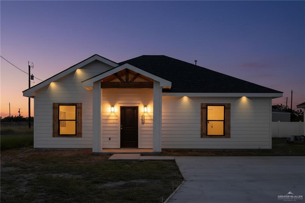 a front view of a house with yard