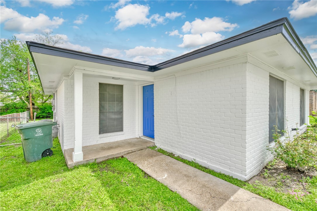 3911 Olive Street, Unit B Bryan, TX 77801 - Photo 2 of 12 a front view of a house with garden