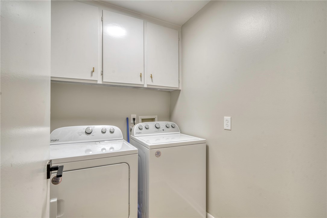 3911 Olive Street, Unit B Bryan, TX 77801 - Photo 10 of 12 a utility room with dryer and washer