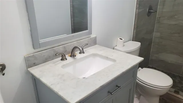 a bathroom with a shower and toilet