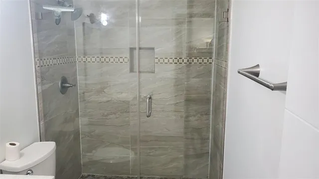 a view of a bathroom from a hallway