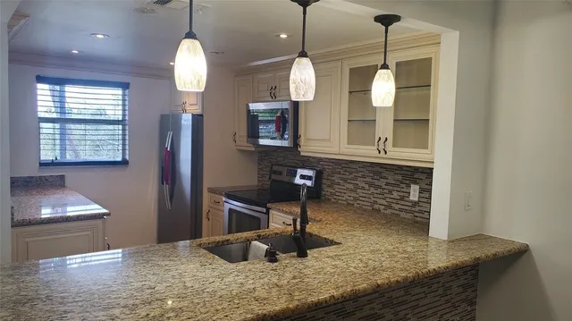 a kitchen with sink and window