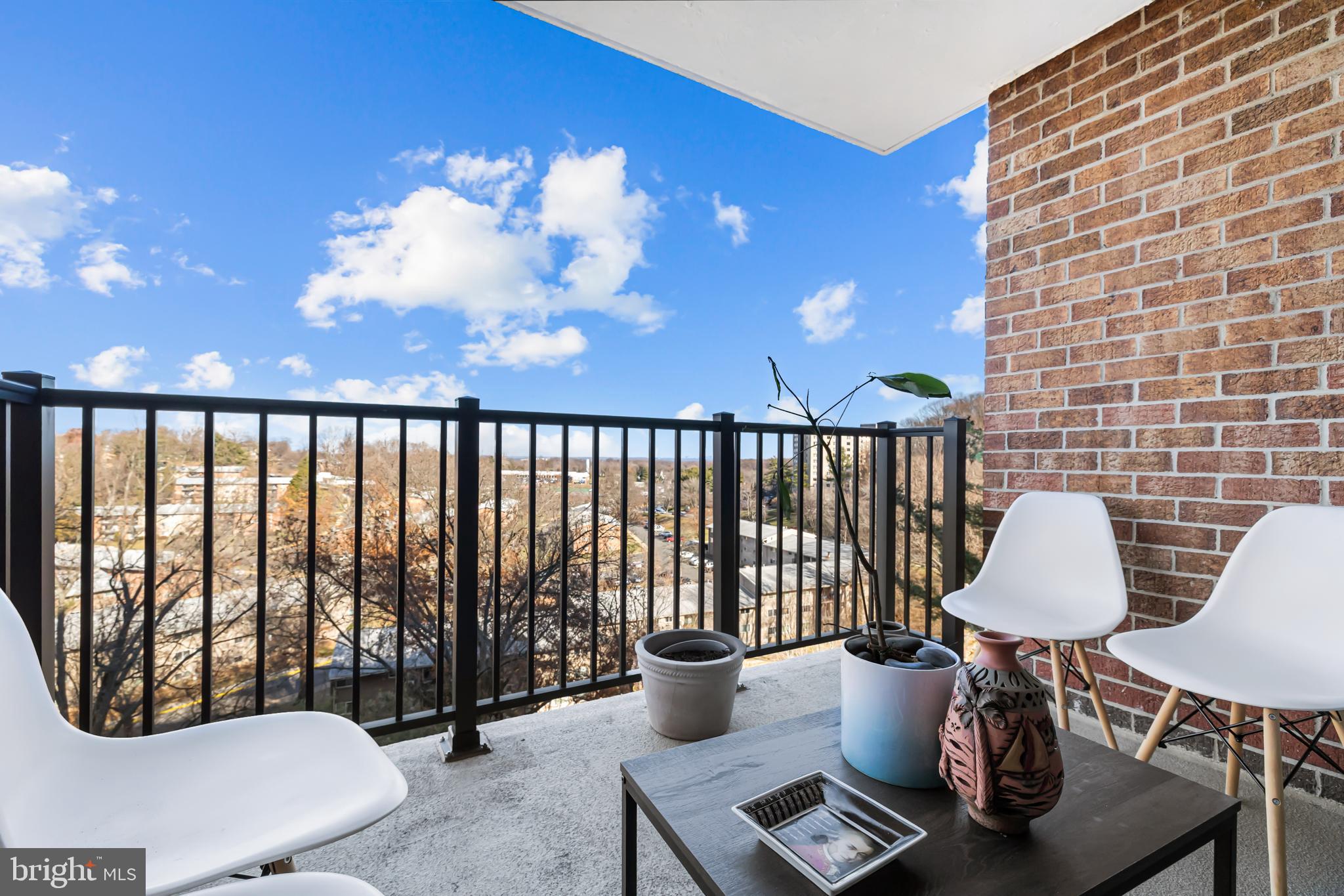 2300 Pimmit Drive, Unit 807 Falls Church, VA 22043 - Photo 11 of 33 a living room with furniture and a large window