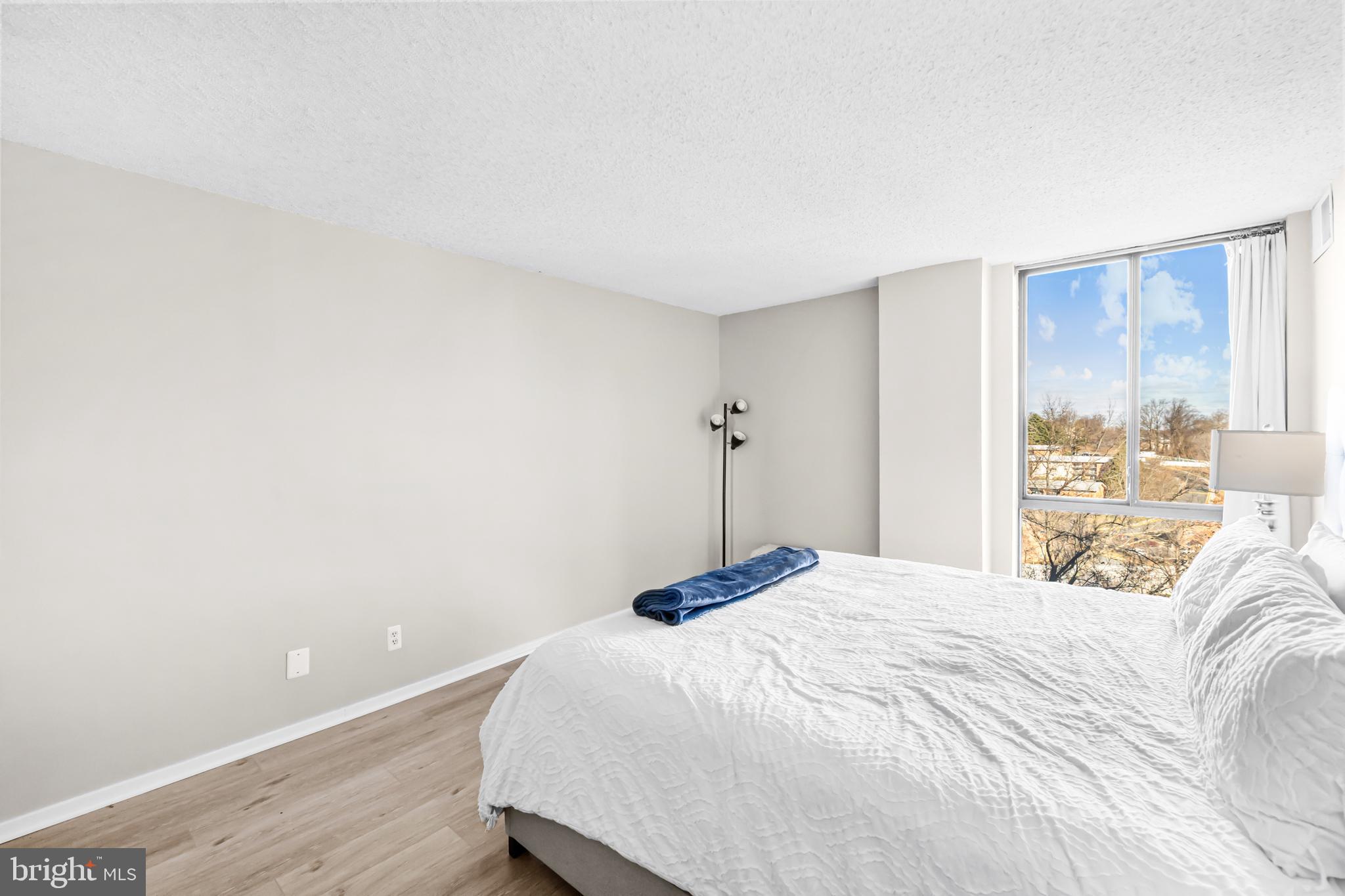 2300 Pimmit Drive, Unit 807 Falls Church, VA 22043 - Photo 19 of 33 a bedroom with a bed and a window