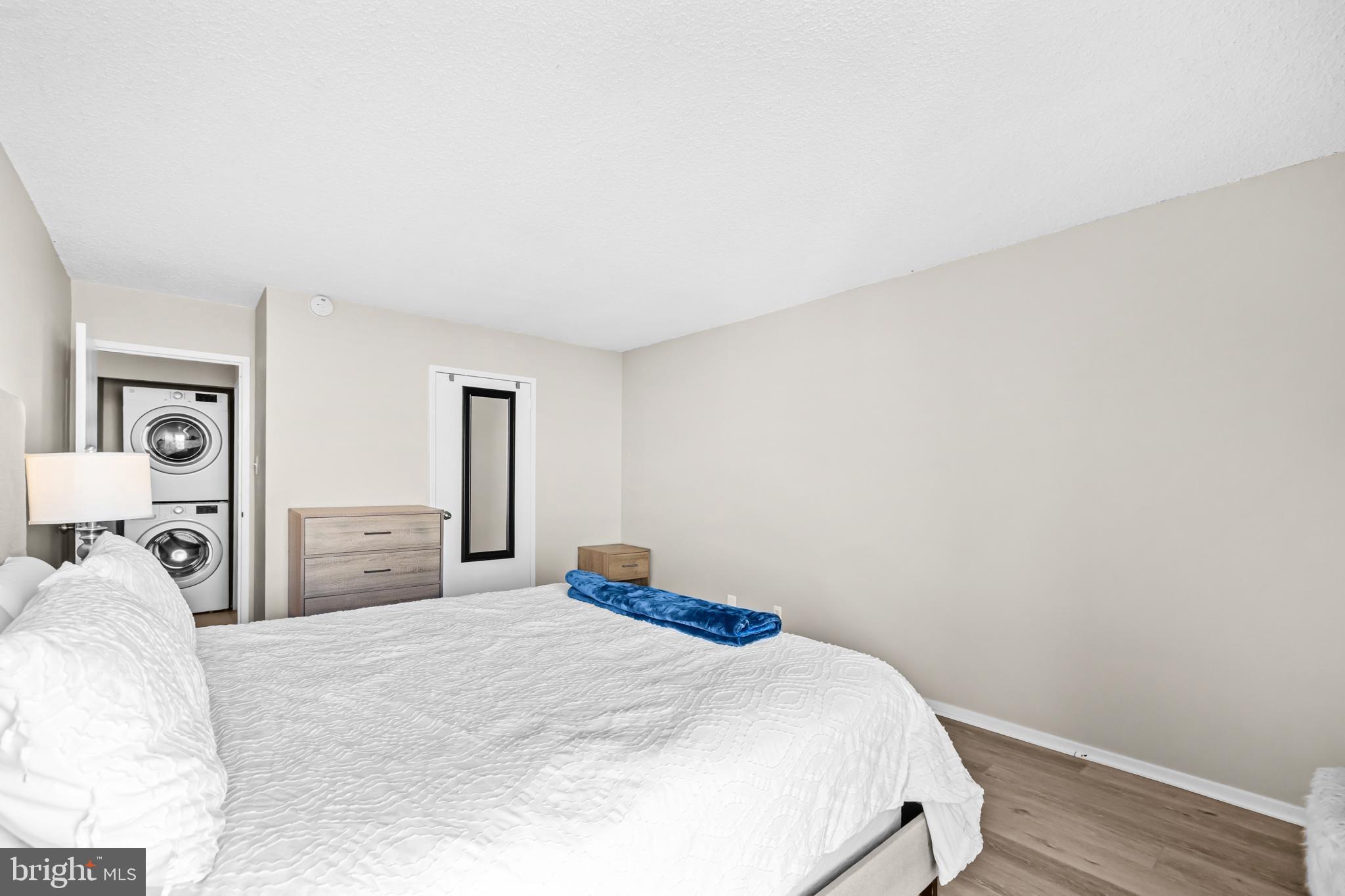 2300 Pimmit Drive, Unit 807 Falls Church, VA 22043 - Photo 20 of 33 a bedroom with a bed and wooden floor