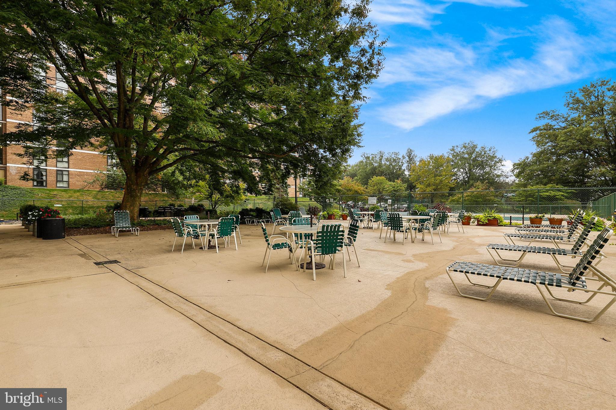 2300 Pimmit Drive, Unit 807 Falls Church, VA 22043 - Photo 27 of 33 a view of a patio with chairs and potted plants
