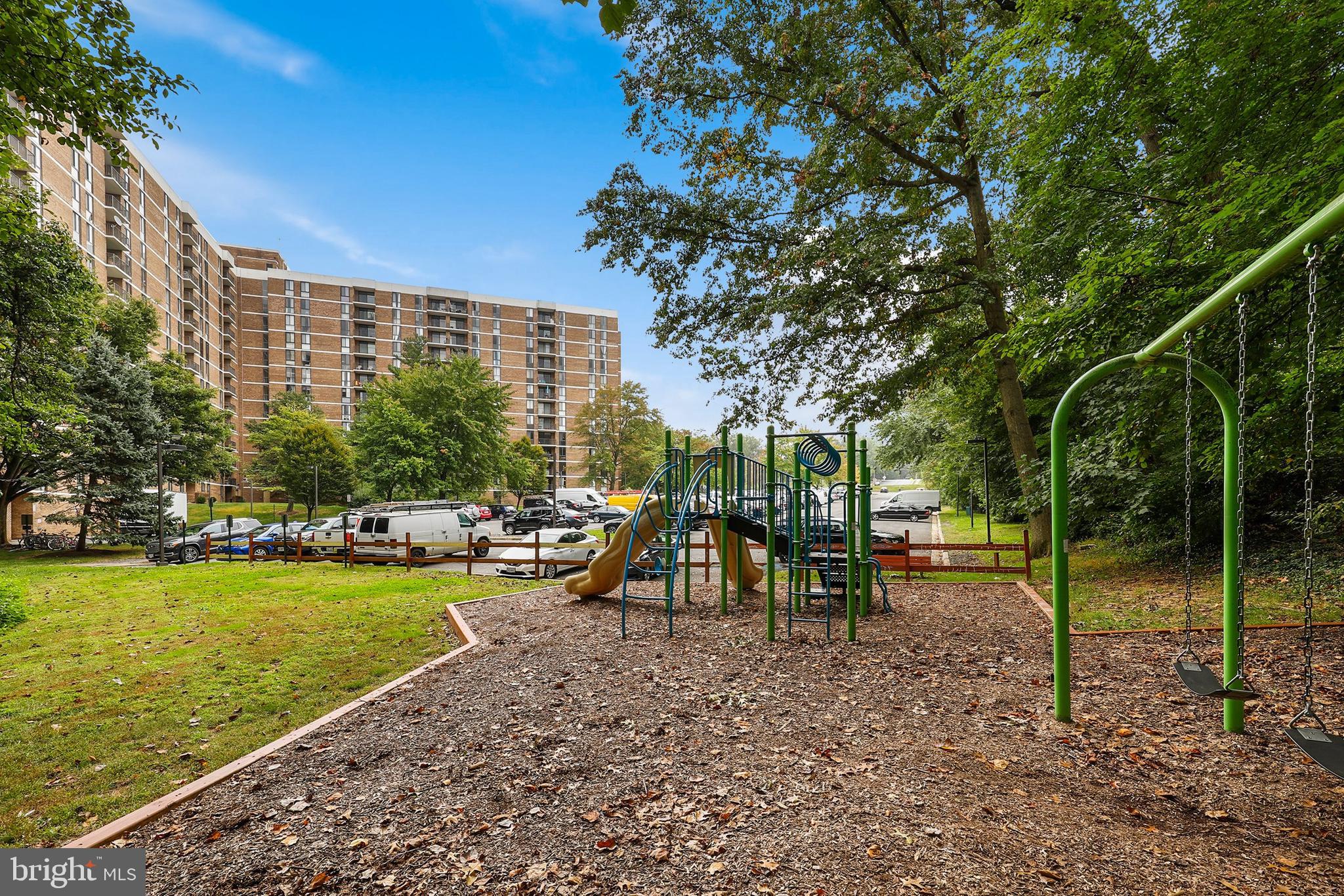 2300 Pimmit Drive, Unit 807 Falls Church, VA 22043 - Photo 30 of 33 a view of a park with swings and slides