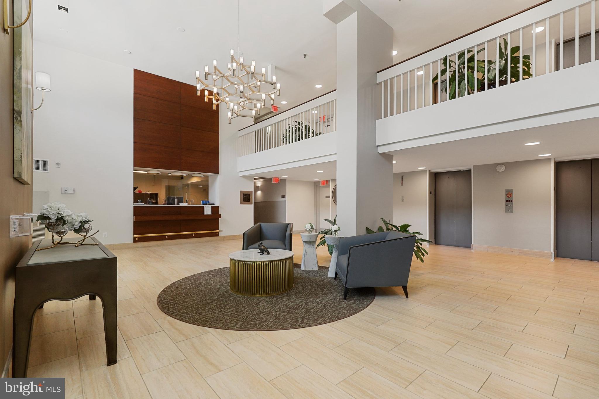2300 Pimmit Drive, Unit 807 Falls Church, VA 22043 - Photo 5 of 33 a living room with furniture and a chandelier
