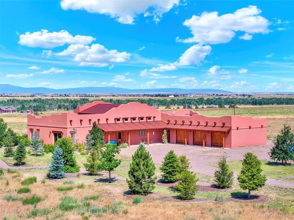 a front view of a multi story building with yard